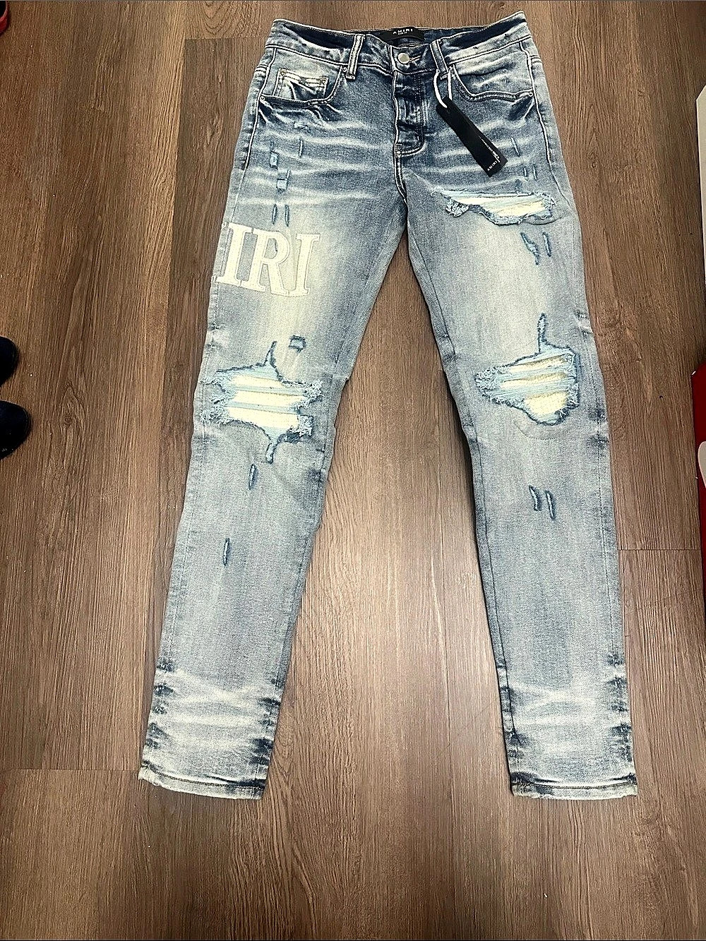 Amiri Clay Indigo Blue Denim Core Applique Logo Jeans Distressed Skinny Jeans in
